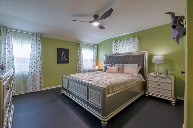 bedroom featuring ceiling fan, lofted ceiling, and dark hardwood / wood-style floors