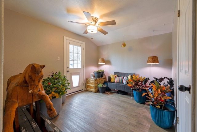 entrance foyer with ceiling fan, vaulted ceiling, and hardwood / wood-style floors