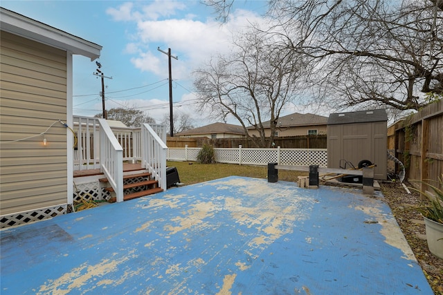 view of patio featuring a shed