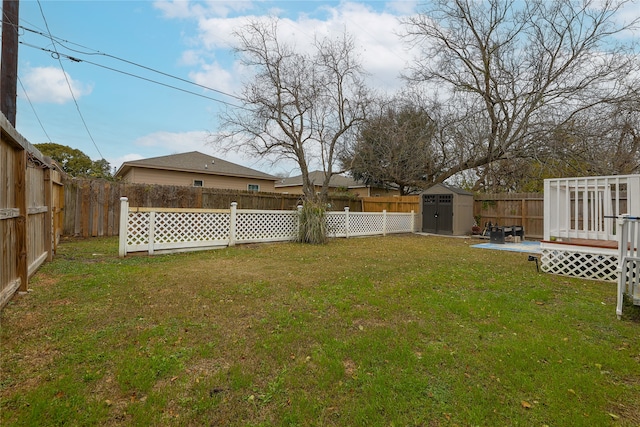 view of yard with a patio area and a shed