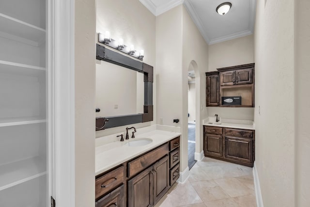 bathroom featuring vanity, tile patterned floors, and ornamental molding