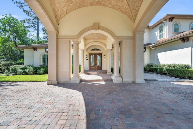 view of exterior entry featuring french doors