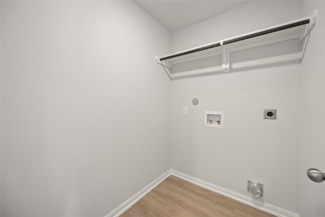 laundry room with gas dryer hookup, electric dryer hookup, wood-type flooring, and washer hookup