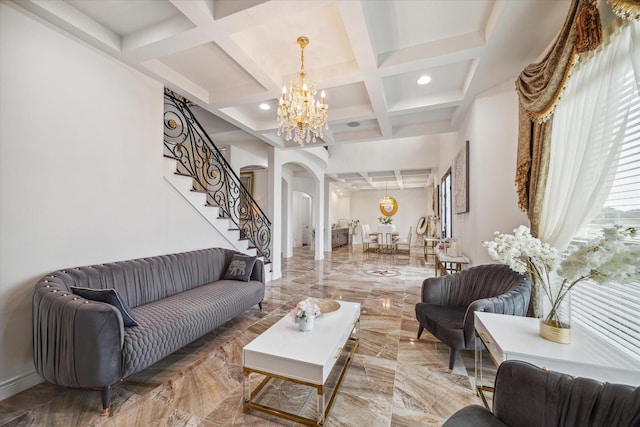 living room with beam ceiling, coffered ceiling, and an inviting chandelier