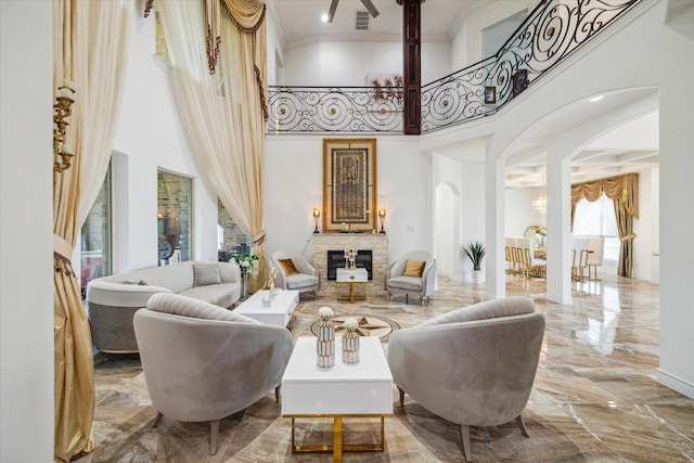 living area featuring a towering ceiling