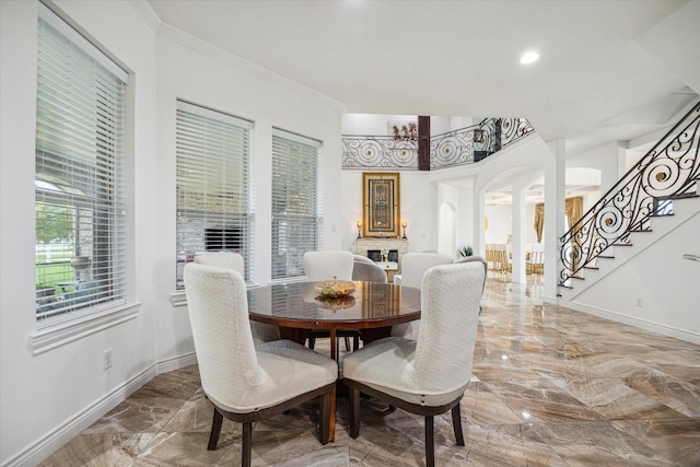 dining room featuring crown molding