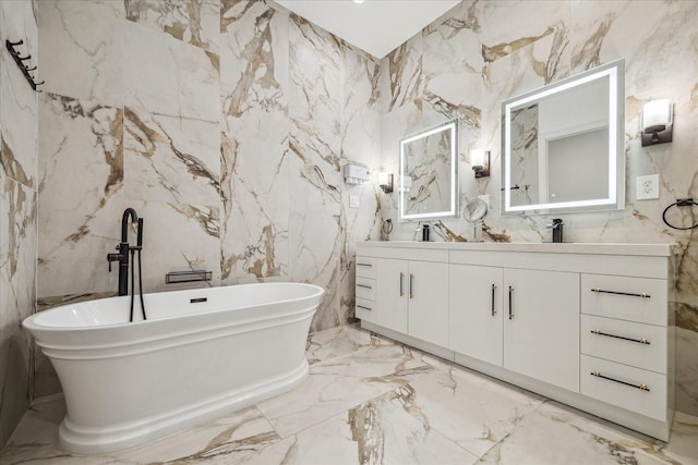 bathroom with a tub and vanity