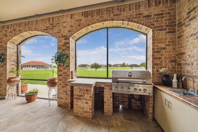 view of patio / terrace featuring sink, exterior kitchen, and area for grilling