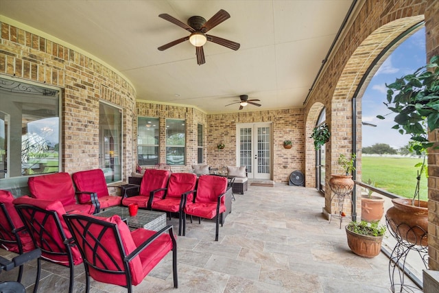 view of patio featuring ceiling fan, outdoor lounge area, and french doors