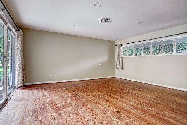 unfurnished room with light hardwood / wood-style flooring