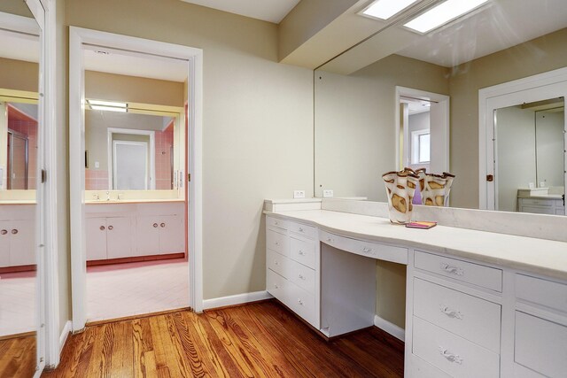 bathroom with hardwood / wood-style flooring and vanity