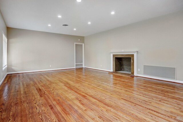 unfurnished living room with light hardwood / wood-style flooring