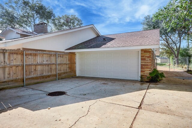 view of side of property featuring a garage