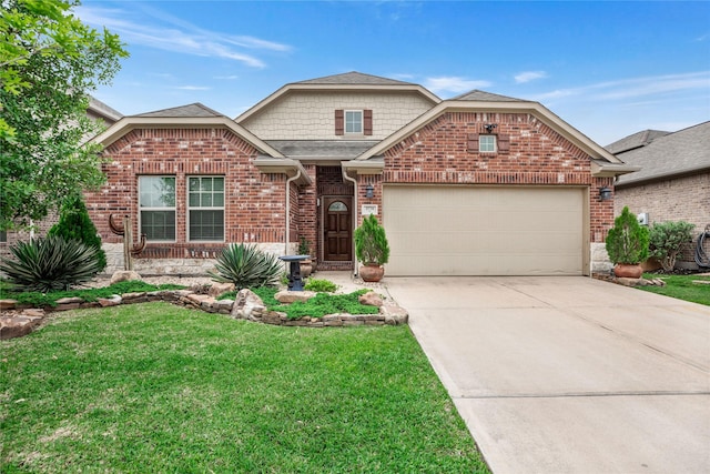 view of front of home with a front yard and a garage