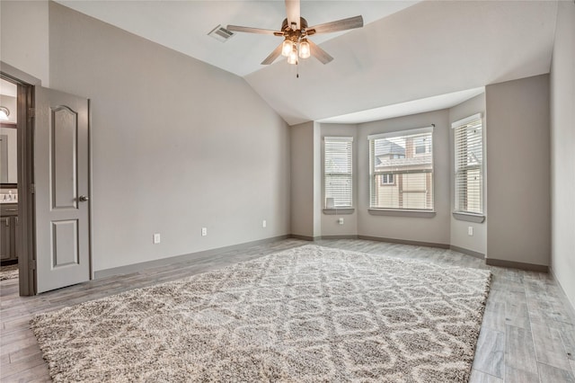 spare room with light hardwood / wood-style floors, lofted ceiling, and ceiling fan