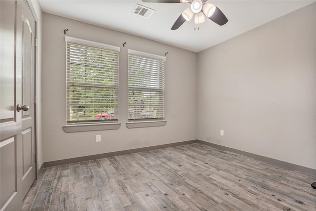 unfurnished room featuring ceiling fan and light hardwood / wood-style flooring