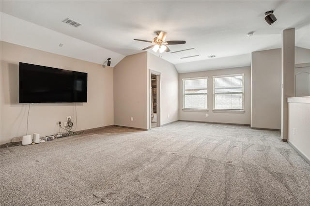 unfurnished living room featuring ceiling fan, light colored carpet, and vaulted ceiling