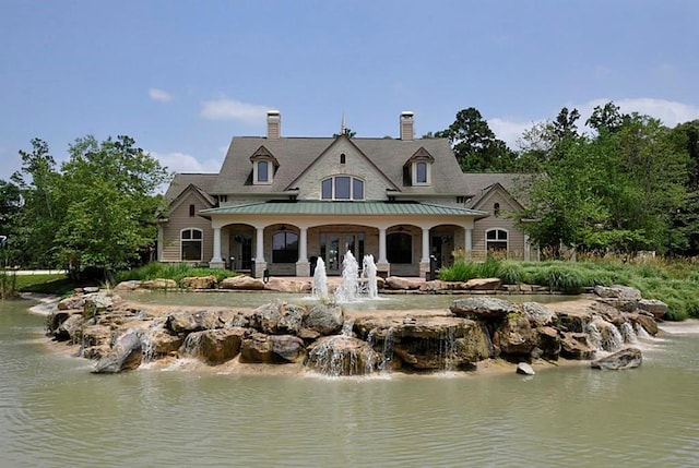 rear view of house with a water view