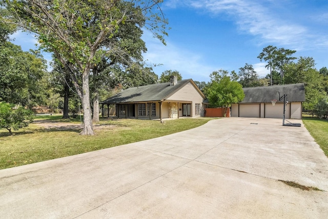 view of front of house with a garage and a front lawn