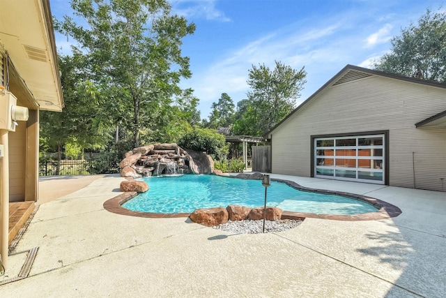 view of swimming pool with a patio area and pool water feature