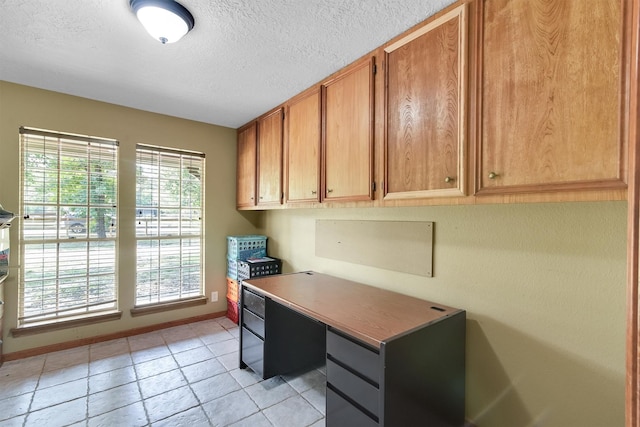 home office with light tile patterned floors