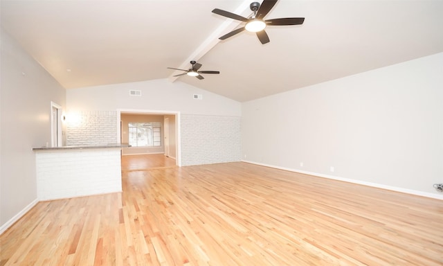 unfurnished living room with light hardwood / wood-style floors, lofted ceiling with beams, brick wall, and ceiling fan