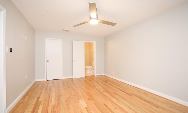 unfurnished bedroom with ceiling fan, light hardwood / wood-style flooring, and ensuite bath