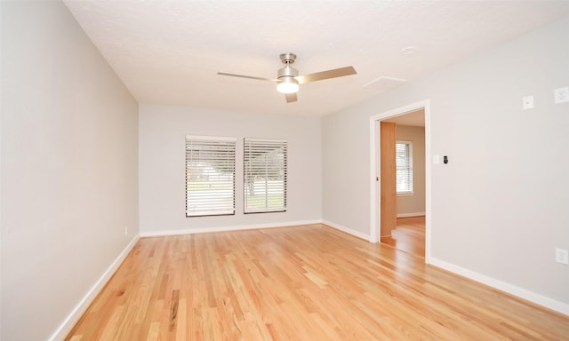 unfurnished room featuring light hardwood / wood-style floors and ceiling fan