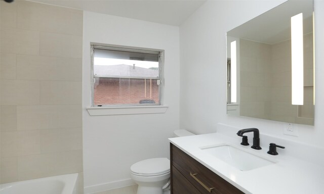 bathroom with toilet and vanity