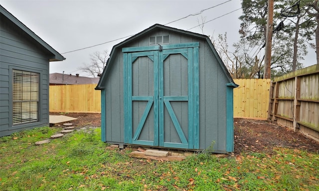 view of outdoor structure featuring a lawn