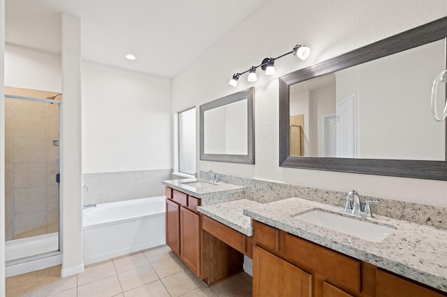 bathroom featuring plus walk in shower, tile patterned floors, and vanity