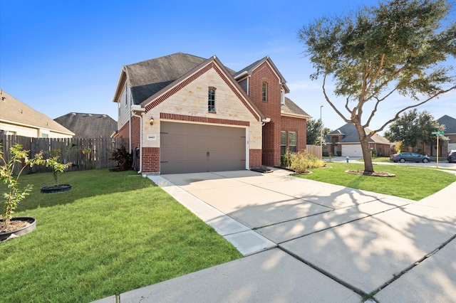 view of front of home featuring a garage and a front lawn