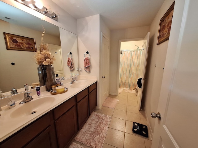 bathroom with tile patterned floors and vanity