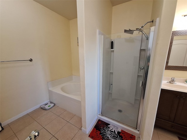 bathroom with tile patterned floors, vanity, and plus walk in shower