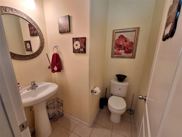 bathroom featuring tile patterned floors and toilet