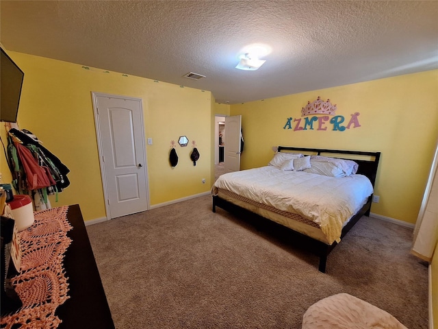 carpeted bedroom with a textured ceiling