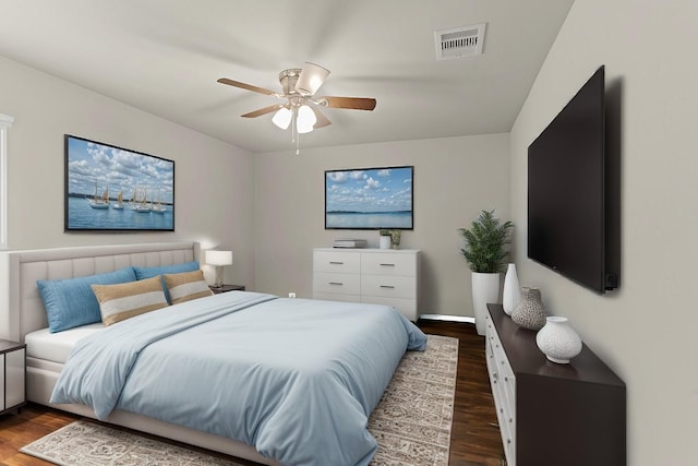 bedroom with ceiling fan and dark hardwood / wood-style floors