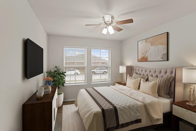 bedroom featuring ceiling fan and dark wood-type flooring