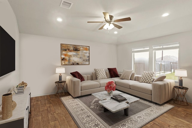 living room featuring ceiling fan and dark hardwood / wood-style flooring