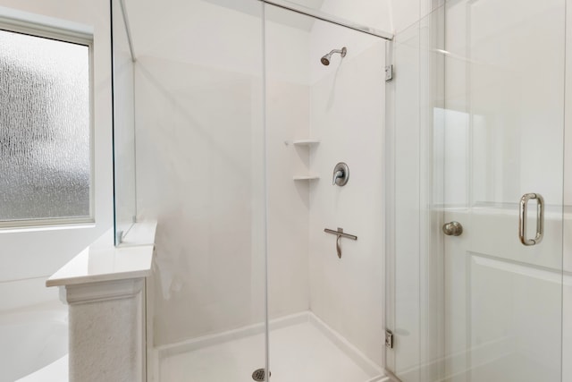 bathroom featuring an enclosed shower