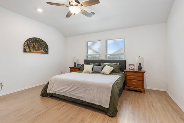 bedroom featuring lofted ceiling, ceiling fan, and light hardwood / wood-style flooring