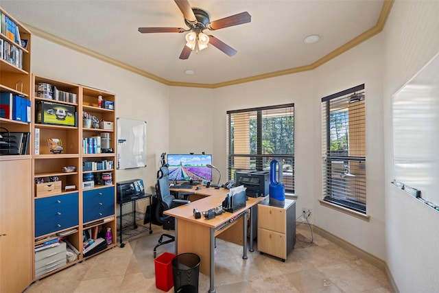 home office with a ceiling fan, crown molding, and baseboards