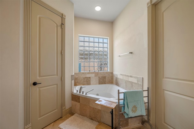 full bathroom featuring a garden tub and tile patterned floors