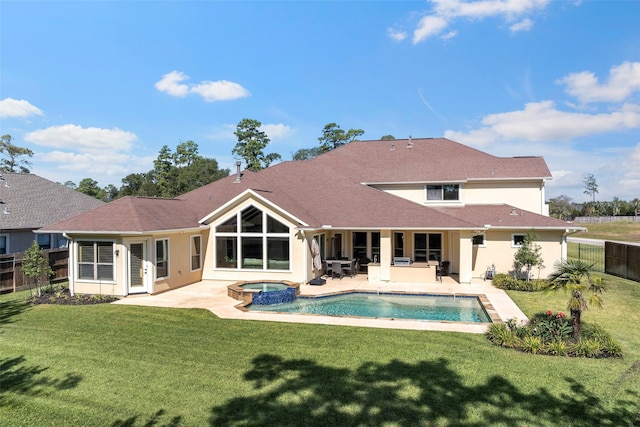 back of house with stucco siding, a fenced backyard, a patio, and a yard