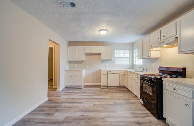 kitchen featuring black range with gas stovetop, white cabinetry, and dishwasher