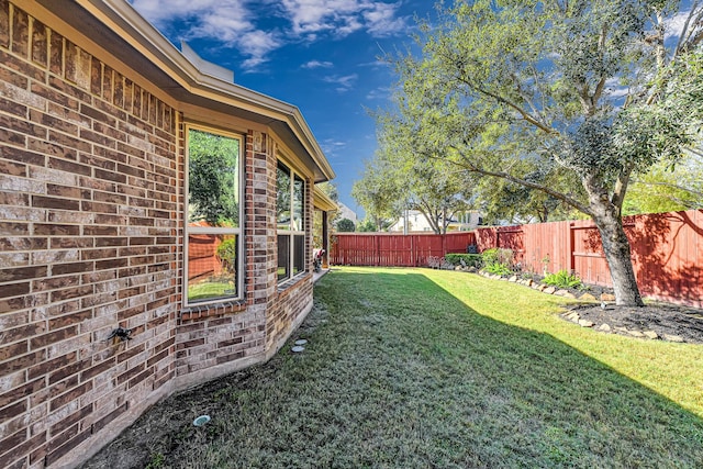 view of yard with a fenced backyard