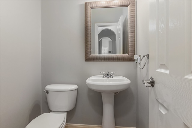 bathroom with sink and toilet