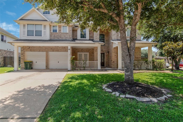 view of front of house featuring a garage and a front yard