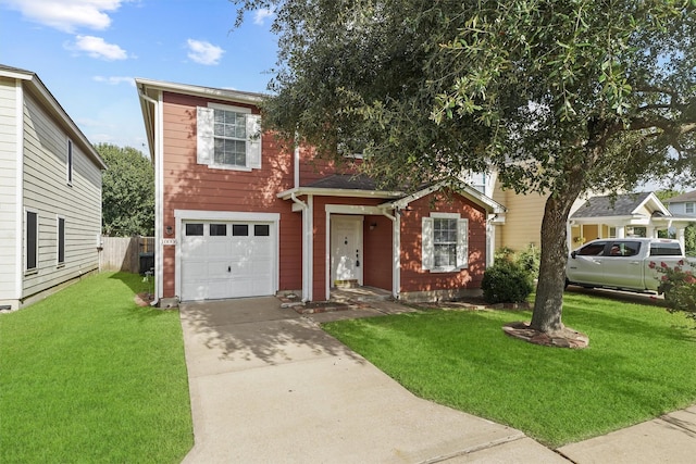 view of front of house with a garage and a front yard