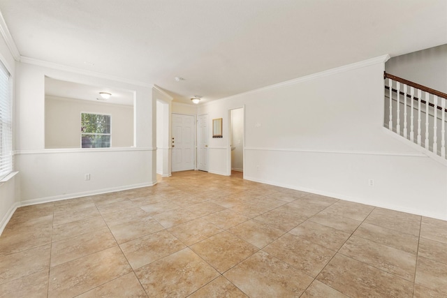 tiled spare room with ornamental molding